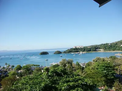 a view of a harbor with boats in the water at BLUE HOUSE OCEAN VIEW in Santa Bárbara de Samaná