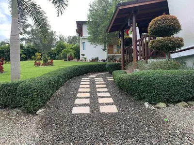 a stone path in front of a house at Villa María Victoria, en Jarabacoa in Jarabacoa