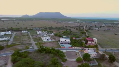 an aerial view of a village with a mountain in the background at Hotel Vista al Morro in San Fernando de Monte Cristi