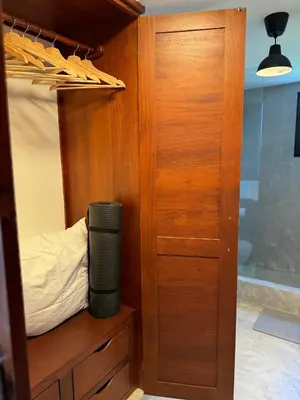 a room with a closet with a bed and a cupboard at Catalina, Cabrera Oceanview Multi 2 BD 2 Bath Condo Units with Balcony and Pool in Caño Seco
