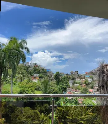 a view of a city from a balcony at HABITACIONES CON VISTA a LA BAHIA LA FAMILIA in Santa Bárbara de Samaná