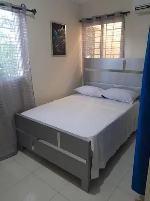 a bedroom with a large bed in a room at SDQ Apartamento Marbella 3 in La Ureña