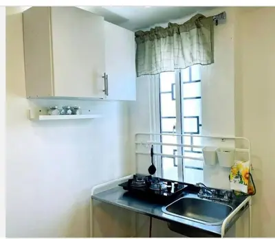 a kitchen with a sink and a window at JC caribe Aparta Hotel #7 in Boca Chica