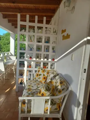 a room with a bed in the corner of a room at Tropical Doña Mayra apartahotel in Las Terrenas