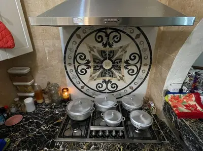 a stove top with a bunch of pots and pans at Country home in the hills of Samana in Santa Bárbara de Samaná