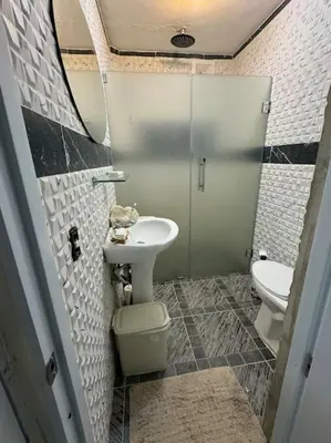 a bathroom with a sink and a toilet at Country home in the hills of Samana in Santa Bárbara de Samaná