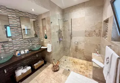 a bathroom with a sink and a shower at Villa Mariposa in Cajuiles