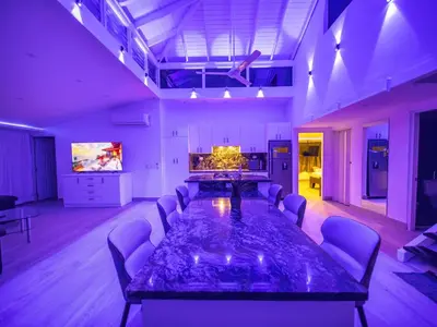 a conference room with a large table and chairs at 3BR Luxury Penthouse, 300m From Beach in Sosúa