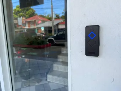 a close up of a door with a blue button at Cozy 1 Bedroom Apartment in Heart of Sosa in Sosúa