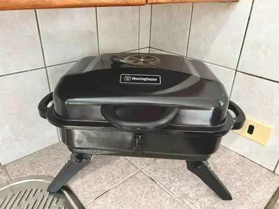 a black pot sitting on top of a stove at Casati Family House, Great Pool Garden in Sosúa