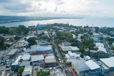 an aerial view of a city with a body of water at 4br Penthouse With Rooftop Pool In Sosua Strip in Sosúa