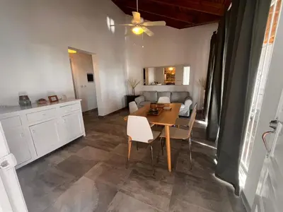 a kitchen and dining room with a table and chairs at Vittoria's House 402 in Bayahibe