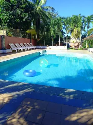 a large swimming pool with two frisbees in it at Cozy & Spacious Apartament Boca Chica Beach in Boca Chica