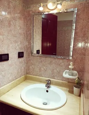 a bathroom with a sink and a mirror at Cozy & Spacious Apartament Boca Chica Beach in Boca Chica