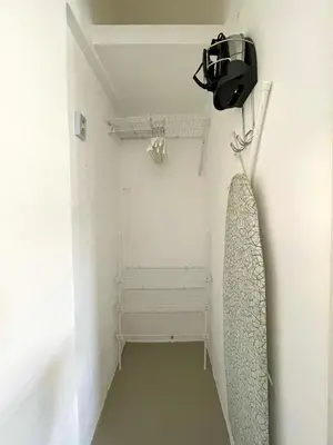 a bathroom with a shower curtain and a fan at Escape Studio Close to Agora Mall in Santo Domingo