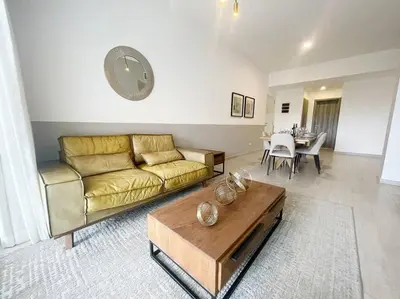 a living room with a couch and a table at Caribbean Retreat at Cana Bay Golf Residence in Punta Cana