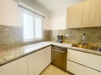 a kitchen with a sink and a window at Caribbean Retreat at Cana Bay Golf Residence in Punta Cana