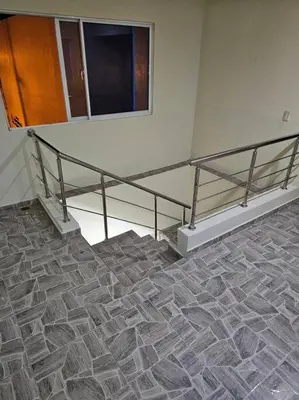 a room with a staircase and a mirror on the wall at hermoso apartamento céntrico in San Felipe de Puerto Plata