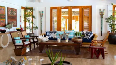 a living room with a couch and chairs at Comfort Condo w/Pool View at Hard Rock Golf Course in Punta Cana