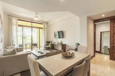 a living room with a table and a couch at Wonderful 1-BR apartment at Casa de Campo in El Infiernito