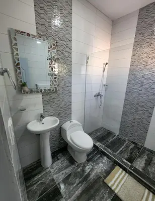 a bathroom with a toilet and a sink at Umbrella Street, city Center, close to many atracctions in San Felipe de Puerto Plata