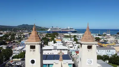 a view of a city with a cruise ship in the background at Umbrella Street, city Center, close to many atracctions in San Felipe de Puerto Plata