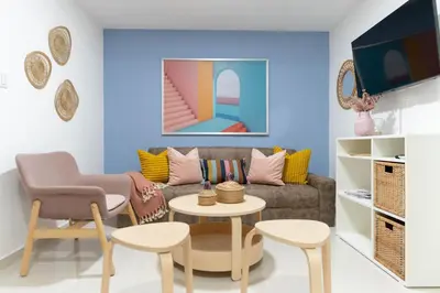 a living room with a couch and a table and chairs at LANDA MAR BOCA CHICA in Boca Chica