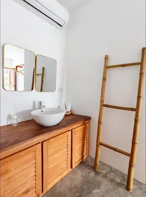 a bathroom with a sink and a ladder at Casa flor - 16 pax, vista al mar, 2 min de la playa in Las Galeras