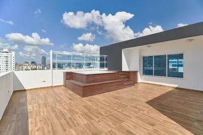 a large living room with a view of a city at Oasis Urbano Family 2br Pool Gym Lm22-8B in Santo Domingo