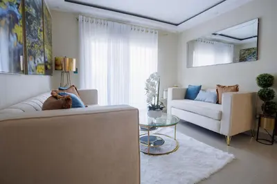 a living room with a couch and a table at Luxury Penthouse in San Francisco de Macorís