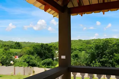 a view from the window of a house with trees at Apart Hotel Costa Verde#4 Exclusivo con cama Queen in Las Galeras