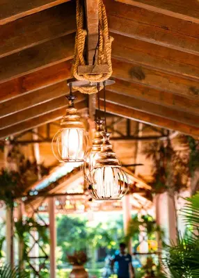 a group of lights hanging from a ceiling at Guacamayos Hotel in Bonao