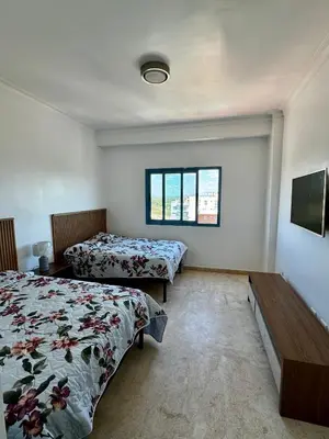 a bedroom with two beds and a window at Juan Dolio, Beach Access 2 BR Apt Salitre Tower front of Club Hemingway in Juan Dolio