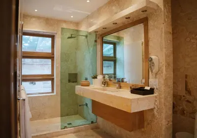 a bathroom with a sink and a shower at Billini Hotel, Historic Luxury in Santo Domingo