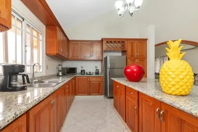 a kitchen with a large pineapple on the counter at Luxe Comfort 8 Bedroom Villa with Private Pool & Entertainment in Sosúa