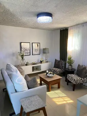 a living room with a couch and a table at Blessed house 