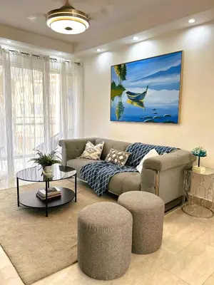 a living room with a couch and a table at Apartamento Riviera Colonial, Santo Domingo in Calero