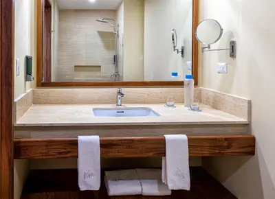 a bathroom with a sink and a mirror at Viva Miches by Wyndham, a Trademark All Inclusive Resort in Miches
