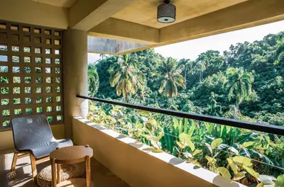 a room with a view of the jungle at Casa Ataraxia Modern Luxe Villa in Las Terrenas