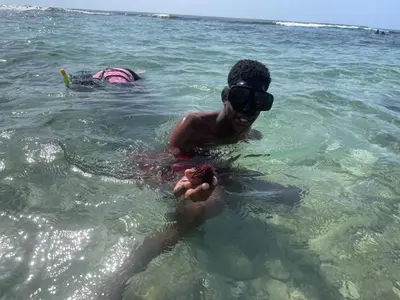 a man in the water wearing virtual reality glasses at A Caribbean-style rebirth, 2 minutes from the beach in La Romana