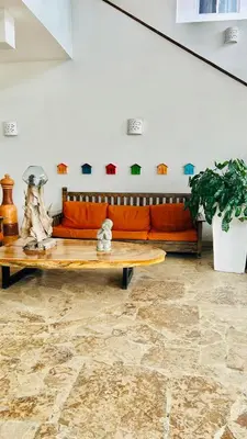 a living room with a couch and a table at Bayahibe Paraíso in Bayahibe