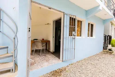 an open door to a room with a table at Mango House. Mono 2 bedrooms in Cabarete