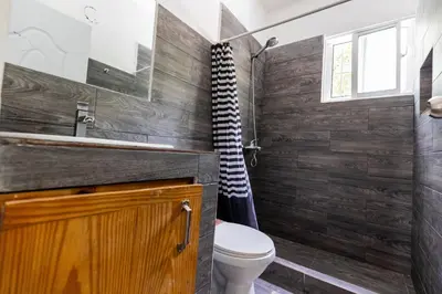 a bathroom with a toilet and a sink at Mango House. Mono 2 bedrooms in Cabarete