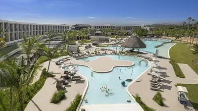 an aerial view of a resort with a swimming pool at Zemi Miches Punta Cana All-Inclusive Resort, Curio by Hilton in Miches