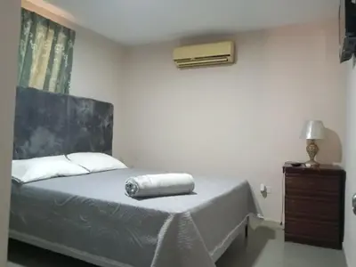a bedroom with a bed with a towel on it at Villa rozenuda in El Higo