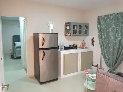 a kitchen with a stainless steel refrigerator in a room at Villa rozenuda in Boca Chica