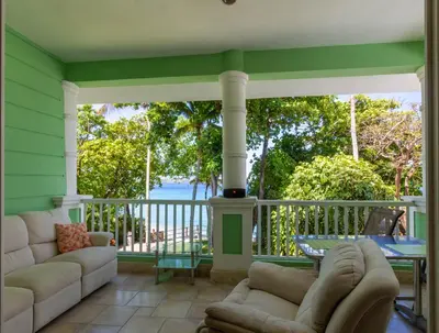 a screened in porch with a couch and a table at 