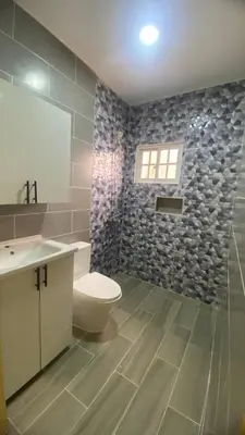 a bathroom with a toilet and a sink at Estefany Aparment New in San Felipe de Puerto Plata
