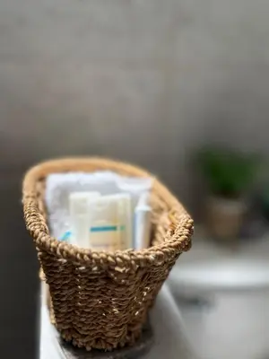 a basket filled with toothbrushes and toothpaste at Cerca de Aeropuerto , bleseed house in Monte Adentro