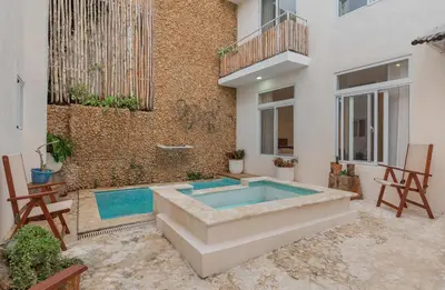 a swimming pool in the middle of a building at 3 Studios at Casa Areito in Santo Domingo